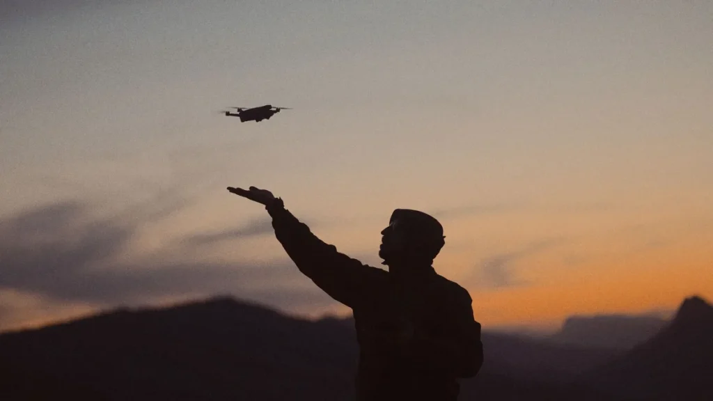 Do I Need an SFOC? 3 Clear Questions for Canadian Pilots 4 Pilot launching a folding drone at dusk, the moment the do I need an SFOC question has to be settled