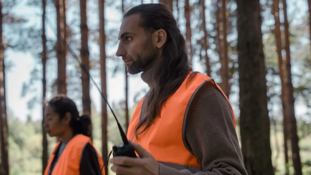 SFOC Application in Canada: 8 Critical Steps and Costs 4 Crew members in high-visibility vests with a radio, the pilots and observers whose qualifications an SFOC application must list