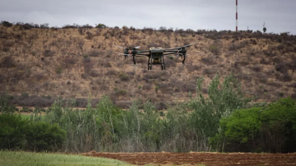 RPOC vs SFOC: 2 Paths, 1 Clear Answer for Your Drone Work 2 Medium agricultural spray drone in flight, the weight class where the RPOC vs SFOC question is decided by the operation rather than the aircraft