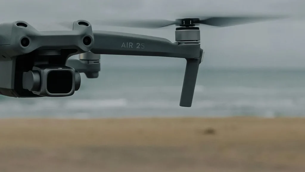Learn How to Fly a Drone: 5 Proven Habits for a Safe Start 3 Drone hovering low over open ground, the first drill when you learn how to fly a drone